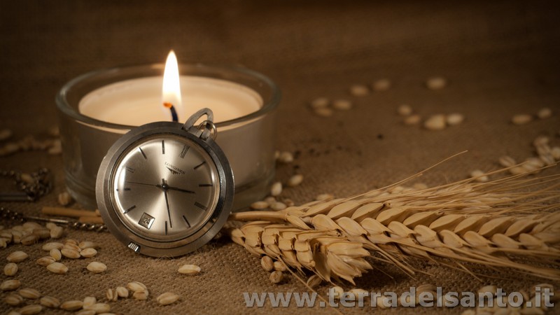 orologio candela chicchi grano